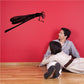 Black dragonfly perched wall decal