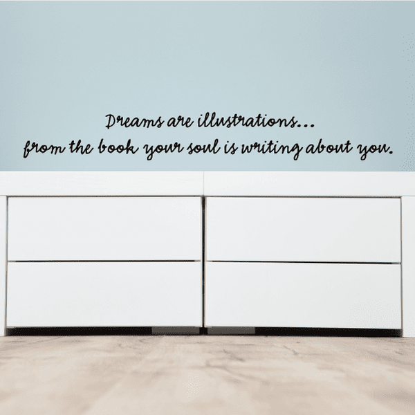Wall decal with cursive quote text: Dreams are illustrations and your soul is writing.