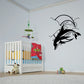 Black dolphin and moon wall decal with multiple dolphin silhouettes