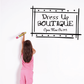 Wall decal with “Dress Up Boutique” lettering and small star accents