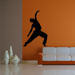 Vinyl wall decal of a black dancer silhouette with dynamic pose