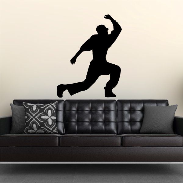 Vinyl wall decal of black dancer silhouette with raised arm