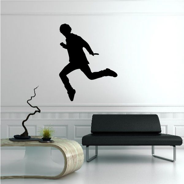 Vinyl wall decal featuring a black dancing silhouette figure