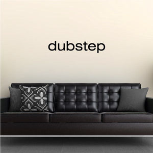 Vinyl wall decal with "dubstep" text in black letters on a light wall