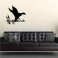 Duck wall decal: black duck silhouette with grass on wall.