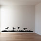 Duck and grass wall decal with black silhouettes of flying ducks over grass