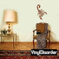 Scorpion wall decal with dark brown silhouette on a light wall