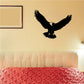 Eagle ascending wall decal: black bird with wings spread and small gold accents