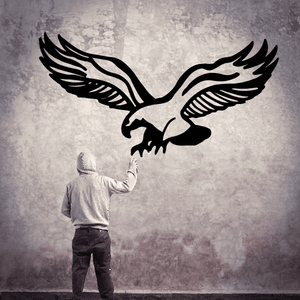 Eagle decal with black eagle silhouette and white outline wings spread