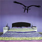Hovering eagle wall decal with wings spread in dark silhouette