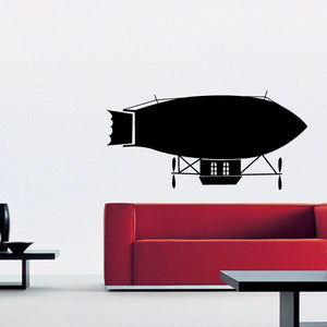 Black blimp airship wall decal with windowed cabin and striped base