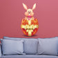 Easter bunny sticker in decorated egg with pink ribbon and golden bow