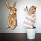 Easter bunny looking sticker, brown and cream cartoon rabbit with long ears