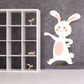Easter bunny presenting sticker with white rabbit and pink ears
