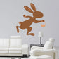 Running brown bunny sticker holding an Easter basket, small decorative wall decal