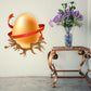 Easter egg wrapped sticker with gold egg, red ribbon, and ornate brown nest design