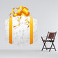 Printed die-cut decal of Easter gift box with orange ribbon and paw/flower pattern