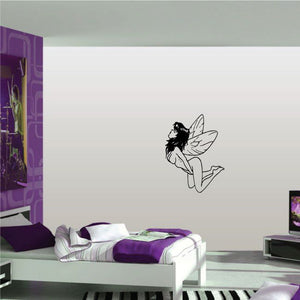 Black fairy wall decal with wings, sitting and holding one hand near face