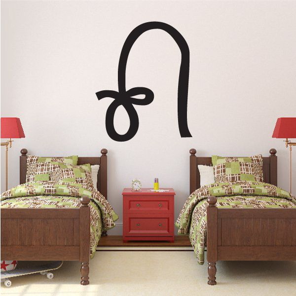 Stylized black hieroglyph letter O wall decal with looped glyphs