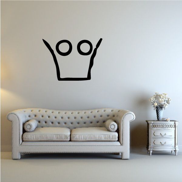 Black crown wall decal with circular eye-like symbols on top
