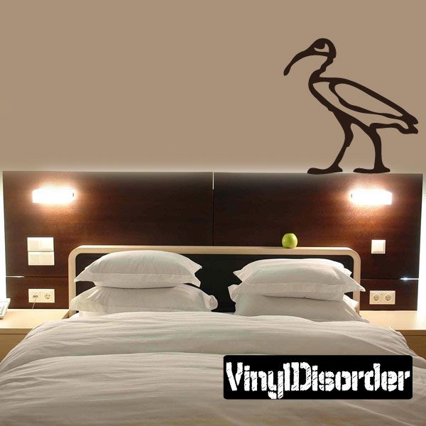 Egyptian hieroglyphics wall decal with black bird-like figure on wall