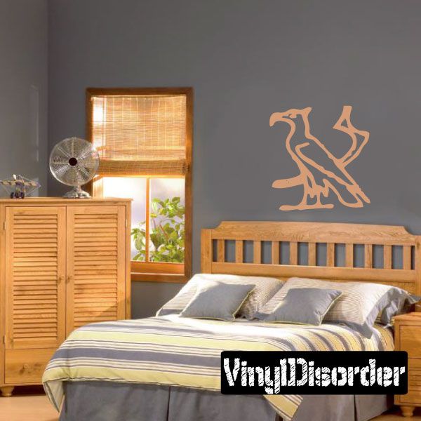 Egyptian hieroglyphics wall decal with stylized symbols, tan on gray wall