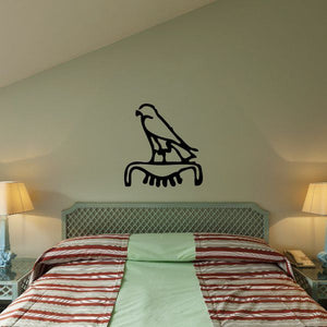 Egyptian hieroglyphics wall decal of a black bird on an arch shape
