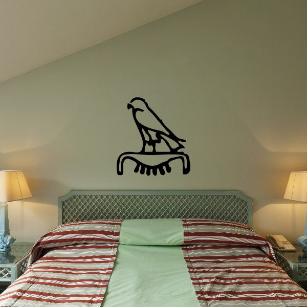 Egyptian hieroglyphics wall decal of a black bird on an arch shape