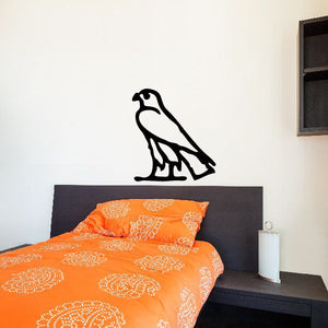 Egyptian hieroglyphics wall decal with bold black bird-shaped symbol