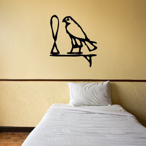 Egyptian hieroglyphics wall decal in black: ankh and bird on a stand.