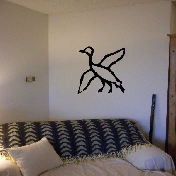Black Egyptian hieroglyphics wall decal with stylized figure and feather-like shape