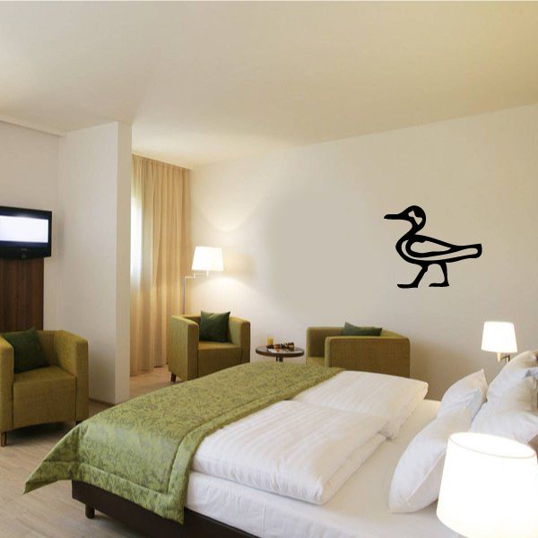 Egyptian hieroglyphics wall decal, dark symbol on bedroom wall above bed