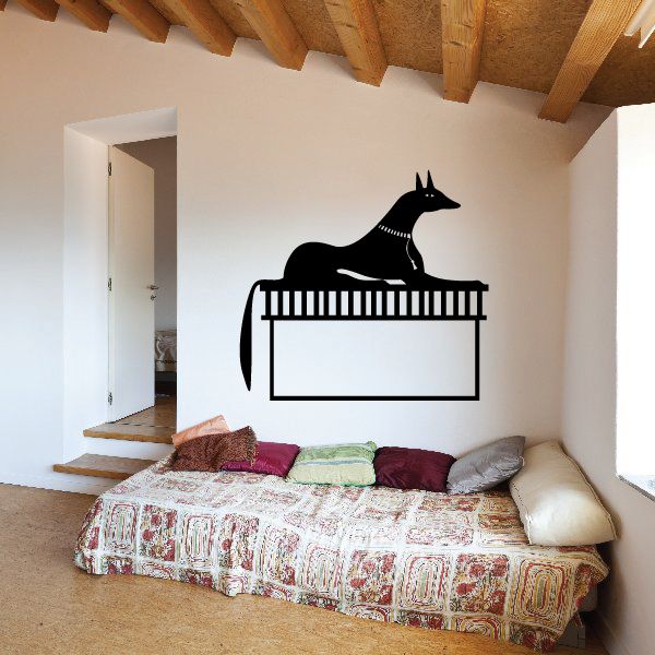 Black jackal decal standing on a piano-style rectangular frame