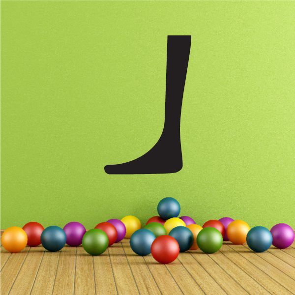 Wall decal of a black leg and foot silhouette