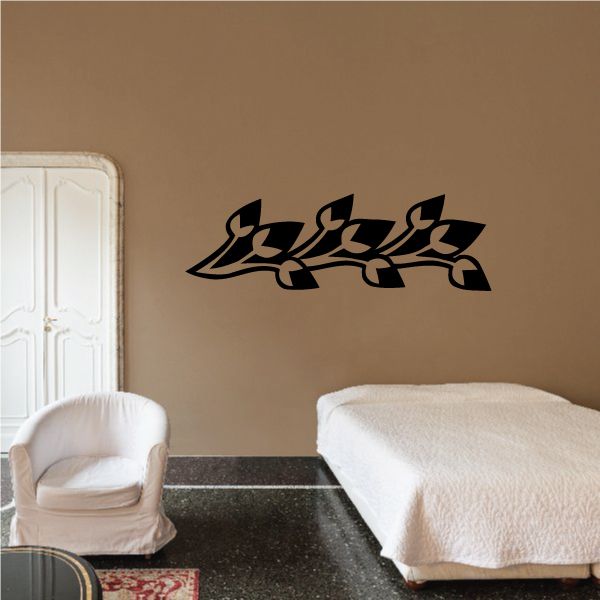 Black vinyl wall decal with ornate scrolling pattern for walls