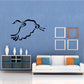 Black flying goose wall decal with curled tail and wings.