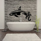 Black orca whale wall decal above bathtub