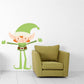 Elf hug sticker with cartoon elf holding arms by a green armchair