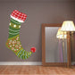 Elf stocking die cut decal with striped green body, red cuff, white trim, and ornaments