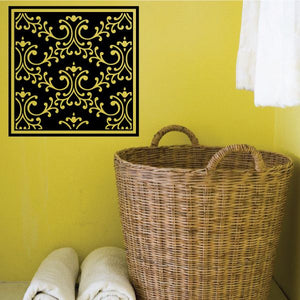 Ornate square vinyl wall decal with black background and gold scrollwork pattern