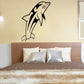 Black dolphin wall decal with arched tail and detailed fins