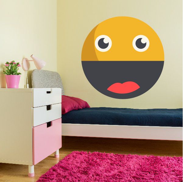 Emoji face wall decal: yellow and black round face with red smile and large white eyes