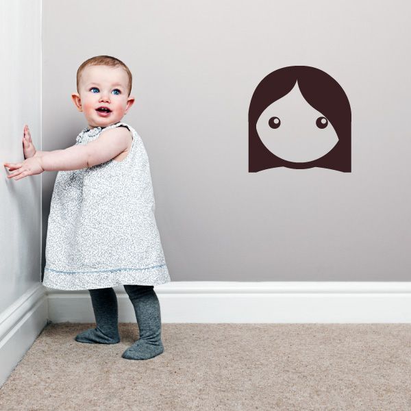 Girl face emoticon wall decal in dark brown and white with large eyes