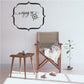 Wall decal with 'Enjoy the' script and compass rose in a scalloped frame