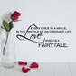 Wall decal with black quote text and cursive 'Love' script, 'FAIRYTALE' highlighted