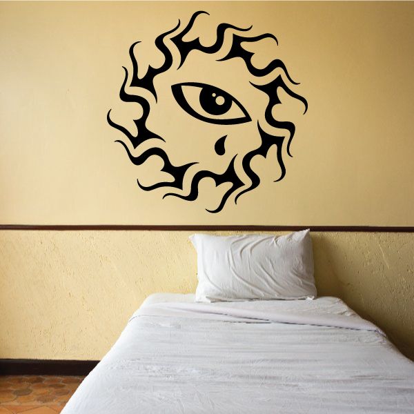 Tribal sun eye vinyl wall decal, black line art face design on wall