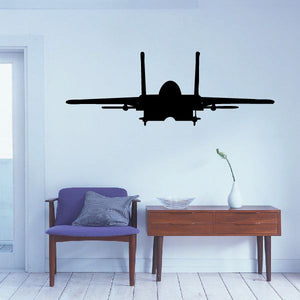 Jet flying decal silhouette with twin tails and wings on light wall