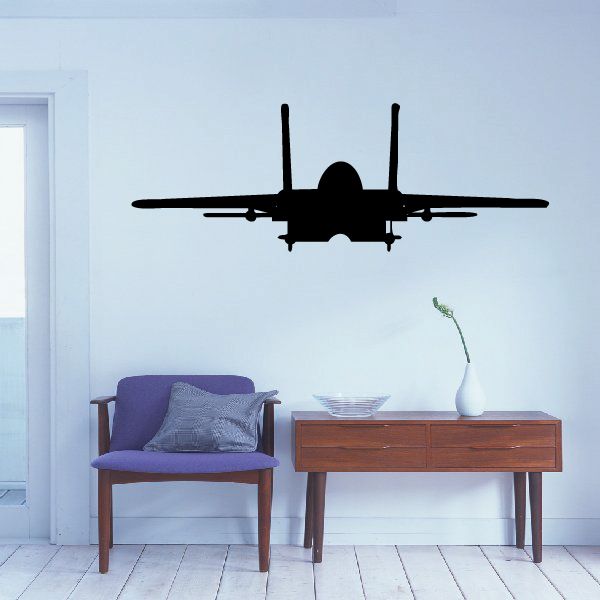 Jet flying decal silhouette with twin tails and wings on light wall