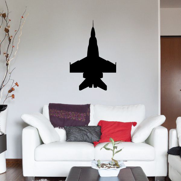 Black FA-18C Super Hornet jet silhouette wall decal above white sofa