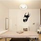 Black falcon head wall decal with sharp beak and feather silhouette